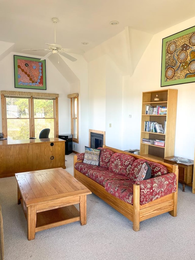 5108 Wildcat Ln, Chincoteague, VA 23336 - living area featuring carpet, vaulted ceiling, ceiling fan, and a glass covered fireplace