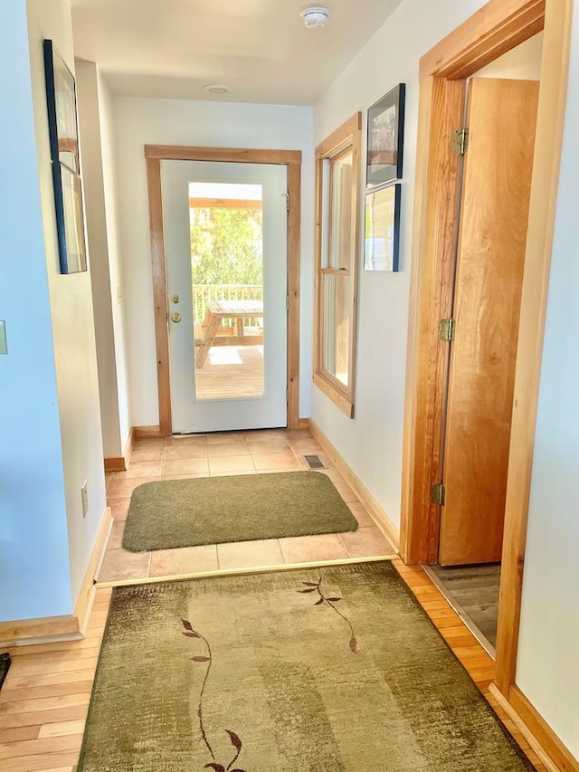 5108 Wildcat Ln, Chincoteague, VA 23336 - hallway with baseboards and light wood-style flooring