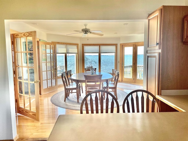 5108 Wildcat Ln, Chincoteague, VA 23336 - dining area featuring light wood finished floors, ceiling fan, and french doors