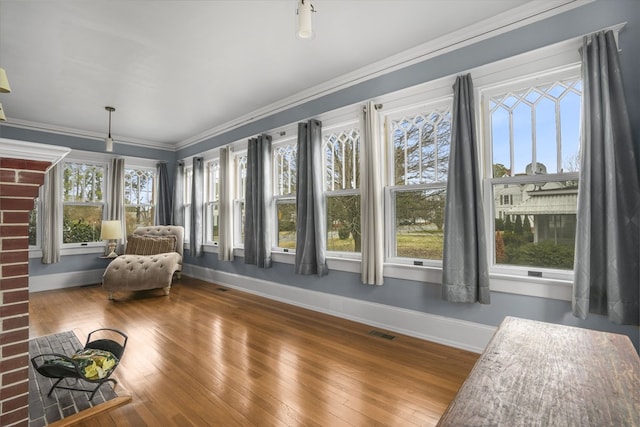 unfurnished sunroom featuring visible vents