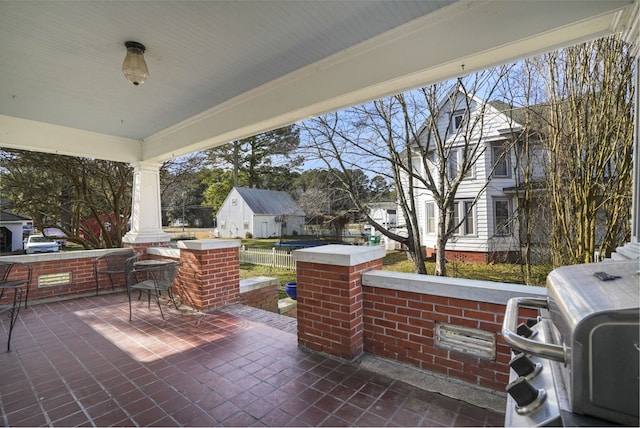 view of patio with covered porch and a residential view