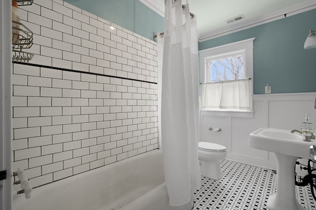 full bath featuring shower / tub combo, visible vents, crown molding, and tile patterned floors