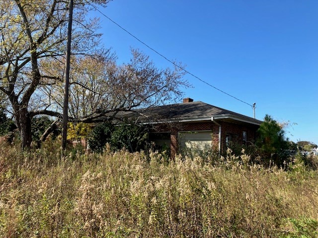 view of side of property featuring a garage