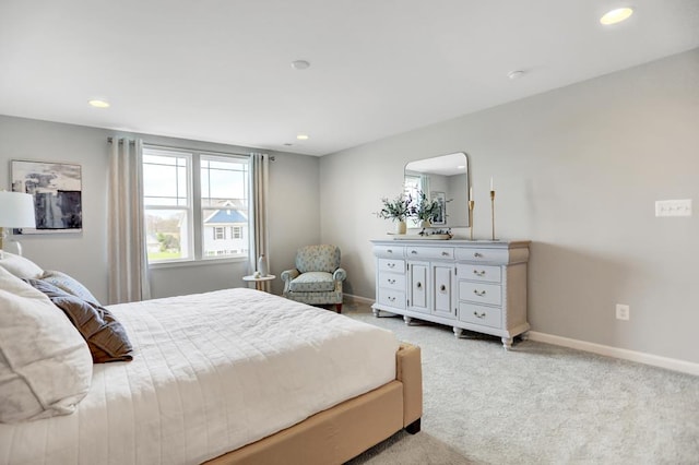 bedroom featuring light carpet