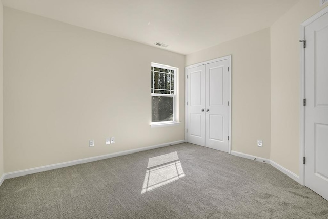 unfurnished bedroom featuring carpet flooring