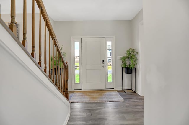 entryway with dark hardwood / wood-style floors