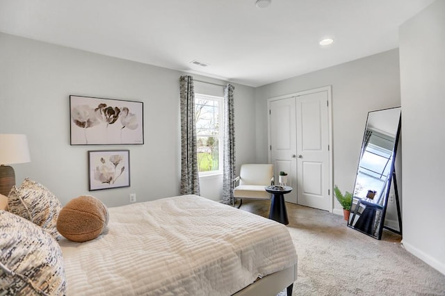 carpeted bedroom with a closet