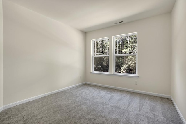 empty room with carpet flooring