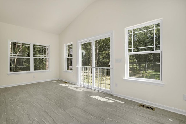 empty room with vaulted ceiling