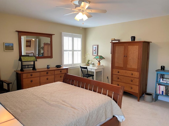 bedroom featuring light colored carpet and ceiling fan