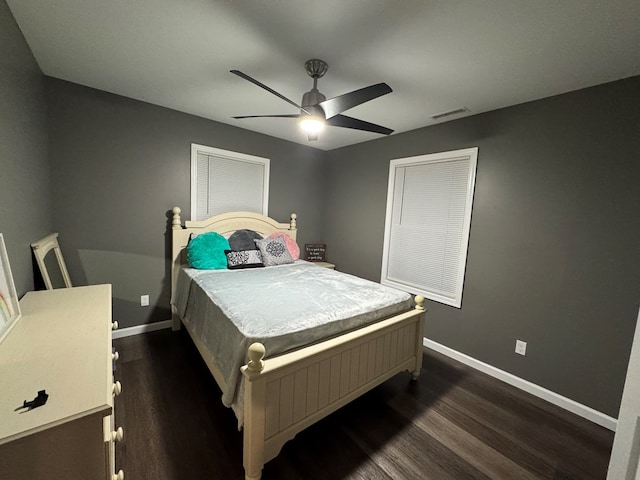 bedroom featuring ceiling fan and dark hardwood / wood-style flooring