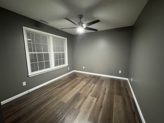 empty room with wood-type flooring and ceiling fan