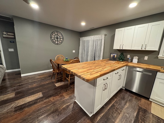 kitchen featuring kitchen peninsula, dishwasher, white cabinets, and wood counters