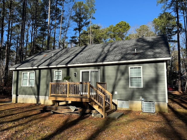 back of property with a wooden deck and central air condition unit