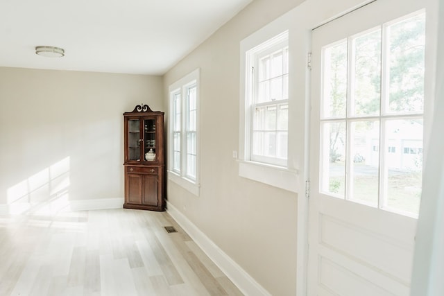 doorway to outside with light hardwood / wood-style floors