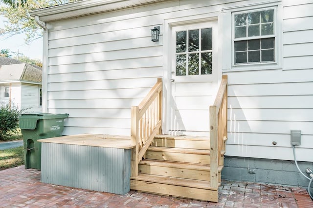 entrance to property with a patio