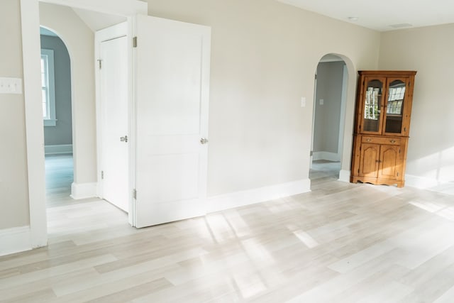 spare room featuring light hardwood / wood-style floors