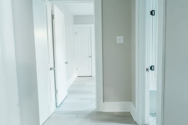 hallway with light wood-type flooring