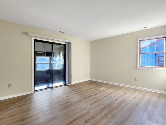 empty room with light wood-type flooring