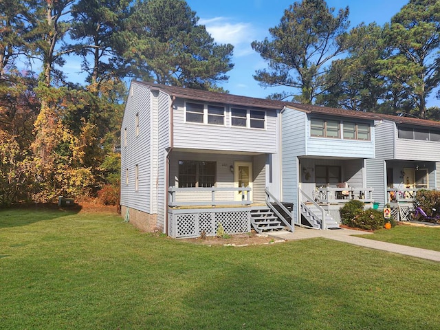 view of front of house featuring a porch and a front yard