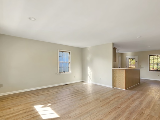 unfurnished room featuring light wood-type flooring