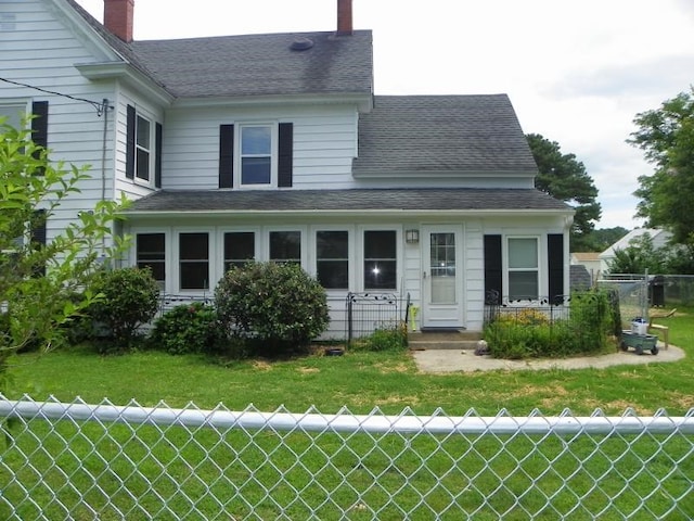 view of front of property with a front lawn