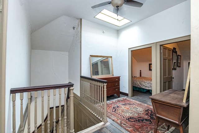 hallway with hardwood / wood-style flooring