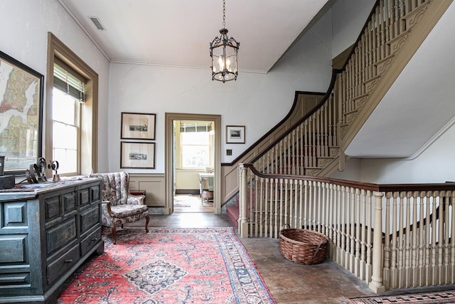 entrance foyer with a notable chandelier and plenty of natural light