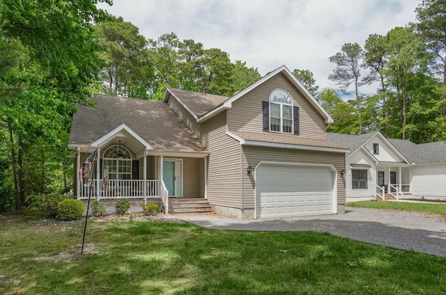 37323 Davey Jones Blvd, Greenbackville, VA 23356 - view of front of house with covered porch, driveway, a front yard, a garage, and a shingled roof
