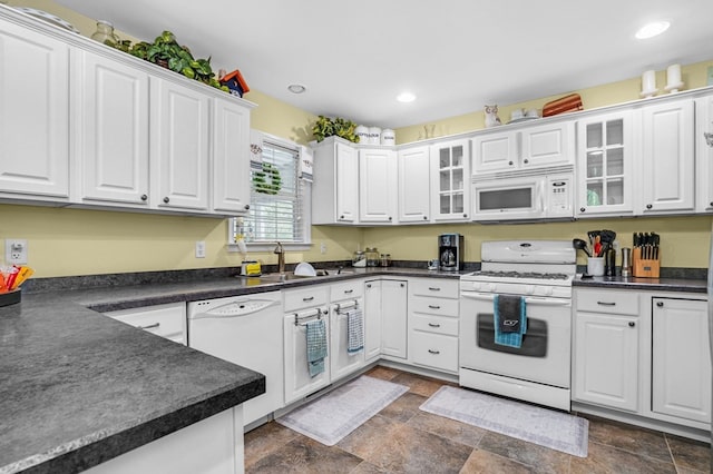 37323 Davey Jones Blvd, Greenbackville, VA 23356 - kitchen featuring white appliances, a sink, white cabinetry, dark stone finish flooring, and recessed lighting