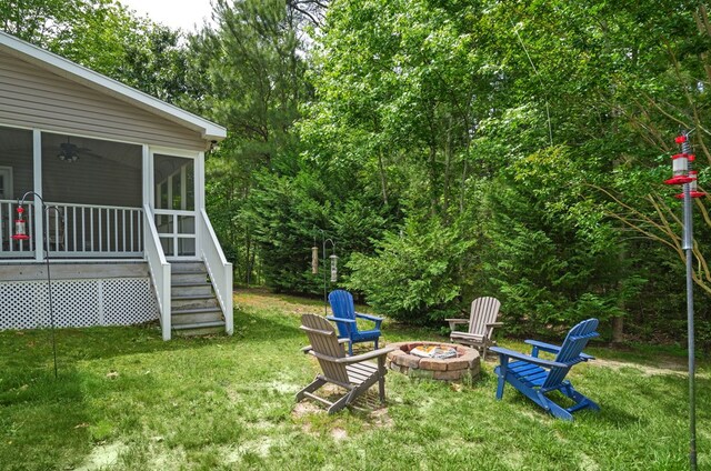 37323 Davey Jones Blvd, Greenbackville, VA 23356 - view of grassy yard with a fire pit and a sunroom