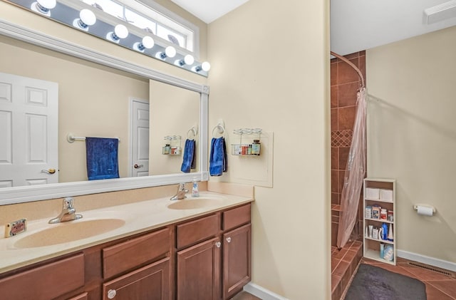 37323 Davey Jones Blvd, Greenbackville, VA 23356 - full bathroom with double vanity, tile patterned floors, a shower with curtain, and baseboards