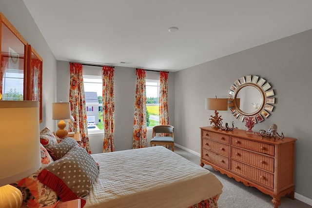 bedroom with light colored carpet