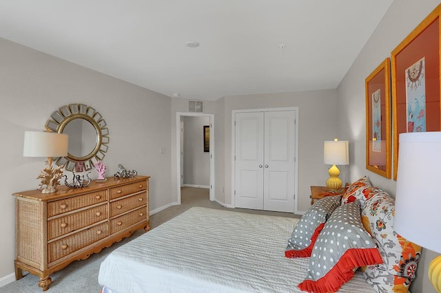 carpeted bedroom featuring a closet