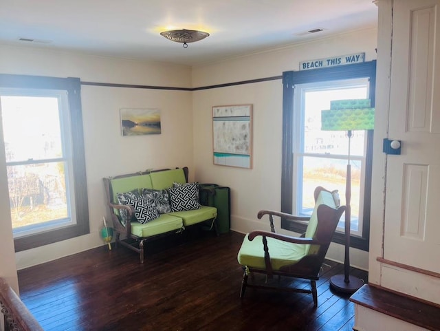 sitting room with visible vents, baseboards, and hardwood / wood-style flooring