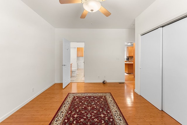 9333 Red Bank Rd, Nassawadox, VA 23413 - unfurnished bedroom with light wood-type flooring, a closet, and baseboards