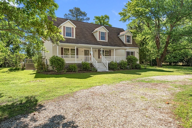9333 Red Bank Rd, Nassawadox, VA 23413 - cape cod house featuring a porch, a front yard, and a shingled roof