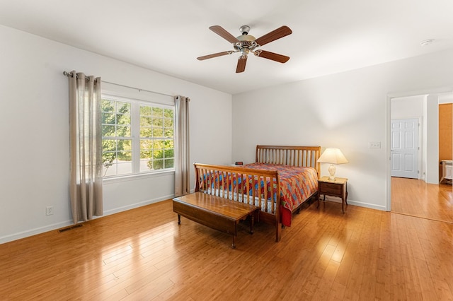 9333 Red Bank Rd, Nassawadox, VA 23413 - bedroom with light wood-style floors, baseboards, and a ceiling fan