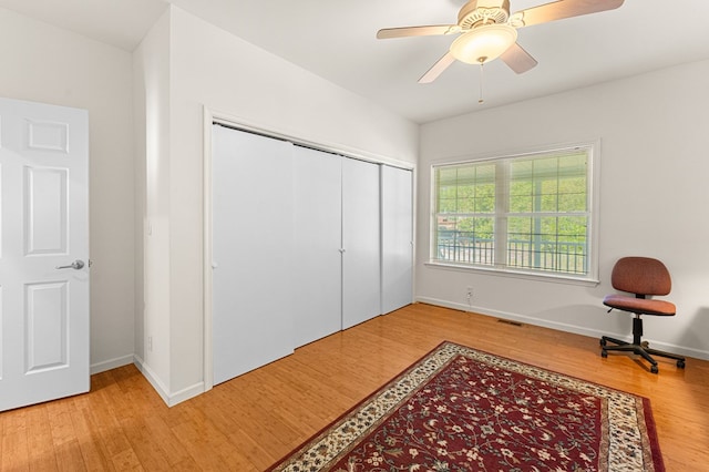 9333 Red Bank Rd, Nassawadox, VA 23413 - bedroom featuring wood finished floors, a closet, baseboards, and ceiling fan