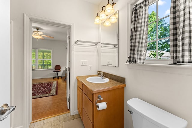 9333 Red Bank Rd, Nassawadox, VA 23413 - half bathroom featuring vanity, toilet, and a ceiling fan