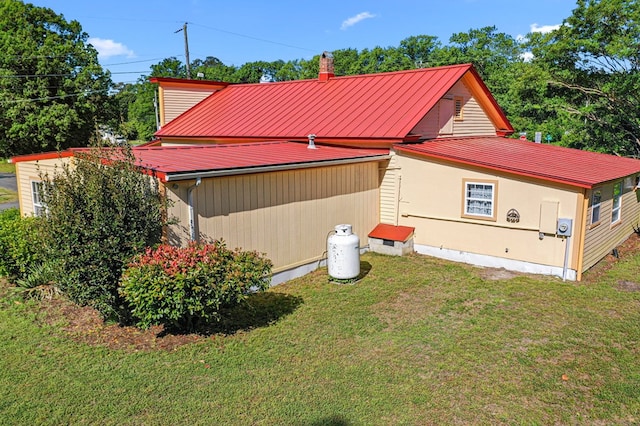 9333 Red Bank Rd, Nassawadox, VA 23413 - view of property exterior with a yard and metal roof