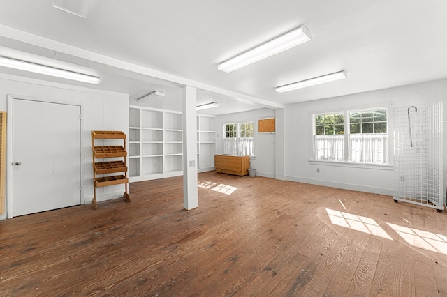 9333 Red Bank Rd, Nassawadox, VA 23413 - unfurnished living room featuring hardwood / wood-style flooring, plenty of natural light, and baseboards