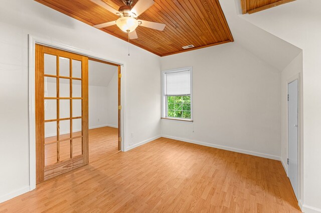 9333 Red Bank Rd, Nassawadox, VA 23413 - unfurnished room featuring light wood-type flooring, a ceiling fan, wood ceiling, vaulted ceiling, and baseboards