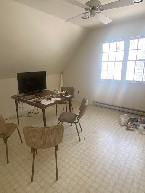 office space featuring vaulted ceiling, ceiling fan, and a baseboard heating unit