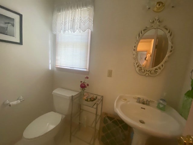 bathroom with sink and toilet