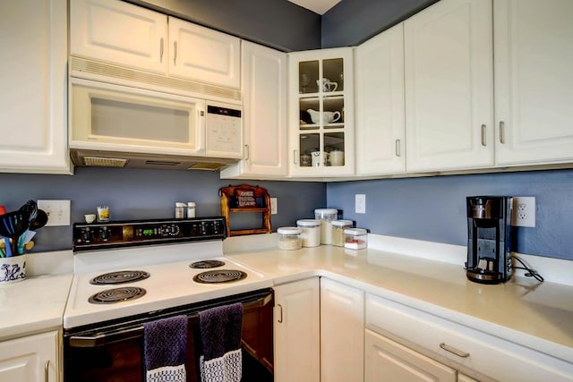 kitchen with range with electric cooktop and white cabinets