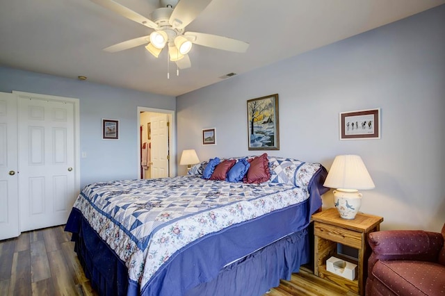 bedroom with hardwood / wood-style flooring and ceiling fan