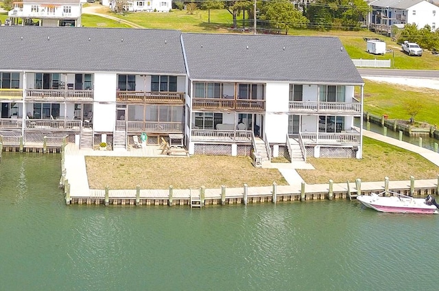 birds eye view of property with a water view