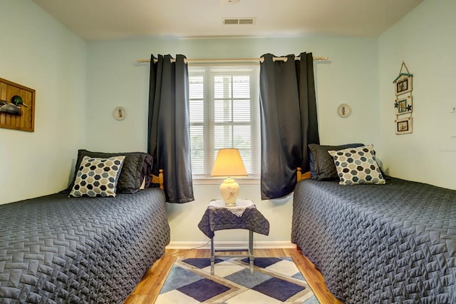 bedroom with light wood-type flooring