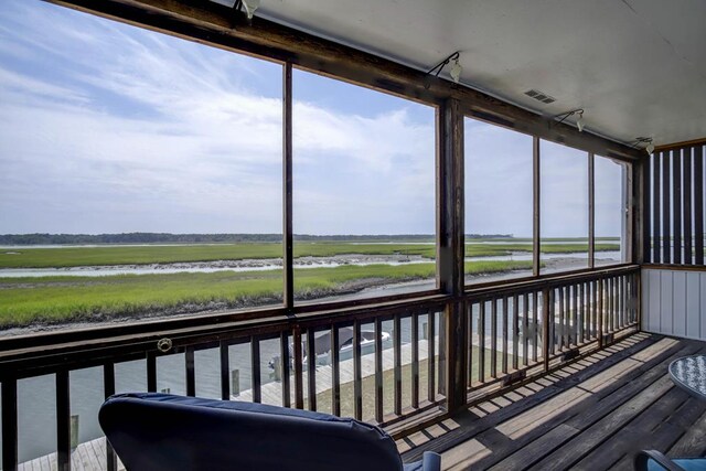 sunroom with a water view